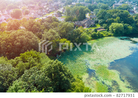 Aerial view of small American town residential community near the pond in Sayreville New Jersey 82717931