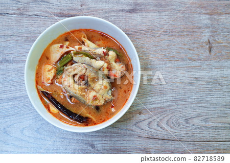 spicy boiled snake head fish meat and slice coconut shoot in tom yum soup on bowl 82718589