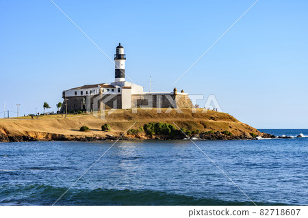 Side view of Barra Lighthouse (Farol da Barra) one of the main historical buildings and tourist spot in the city of Salvador Side view of Barra Lighthouse (Farol da Barra) one of the main historical buildings and tourist spot in the city of Salvador 82718607