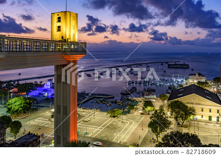 Lacerda elevator illuminated at dusk and with the sea and boats in the background Lacerda elevator illuminated at dusk and with the sea and boats in the background 82718609
