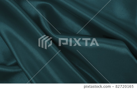 Smooth elegant blue silk or satin luxury cloth texture as abstract background. Luxurious Christmas background or New Year background design Smooth elegant blue silk or satin luxury cloth texture as abstract background. Luxurious Christmas background or New Year background design 82720165