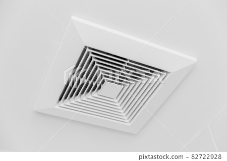 Closeup clean new Ceiling Air Duct air vent flow in office room Closeup clean new Ceiling Air Duct air vent flow in office room 82722928
