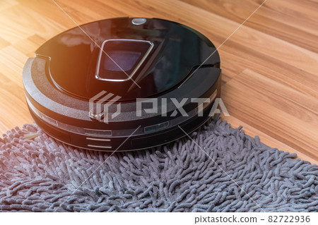 robot vacuum cleaning the floor with doormat automatic home cleaning machine 82722936
