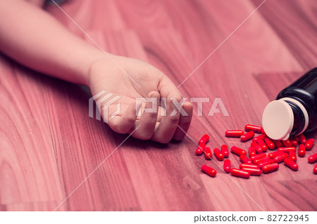 young teen woman take many medicine overdose for suicide from depression disease concept. young teen woman take many medicine overdose for suicide from depression disease concept. 82722945