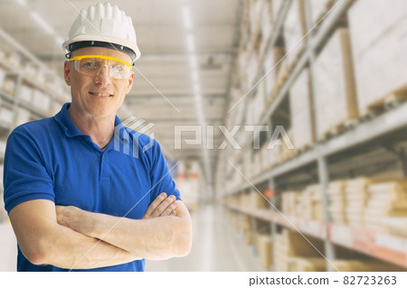 Warehouse inventory store staff worker man employee smart standing smile with space for text. 82723263