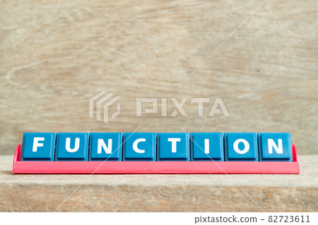 Tile alphabet letter with word function in red color rack on wood background Tile alphabet letter with word function in red color rack on wood background 82723611