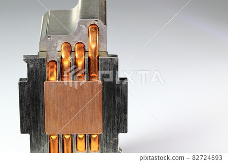 A close up view of CPU Heatsink with copper heat pipe isolated on white background. A close up view of CPU Heatsink with copper heat pipe isolated on white background. 82724893