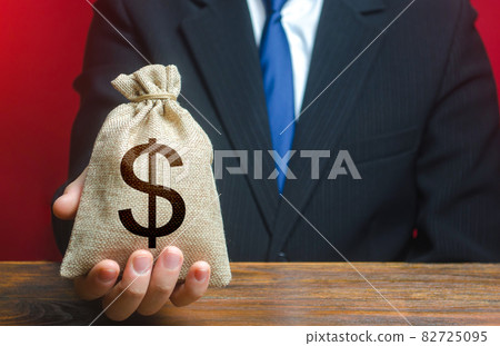 Man gives a dollar money bag. Loan issuance. Financial support, leasing. Earnings and profits. Investments, financing Lobbying. Accounting and accounting, tax payment. Funding, charity. Philanthropy Man gives a dollar money bag. Loan issuance. Financial support, leasing. Earnings and profits. Investments, financing Lobbying. Accounting and accounting, tax payment. Funding, charity. Philanthropy 82725095