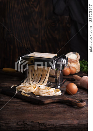 Home Made Pasta by Pasta Maker. an Indifinited Man Cutting the Rigatoni  Stock Image - Image of dinnertime, uncooked: 154064293