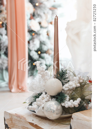 Christmas or New Year home decor with candle Christmas or New Year home decor with candle 82725250
