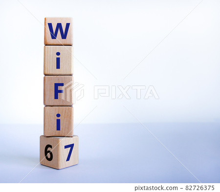 WiFi 6 or 7 symbol. Turned a wooden cube and changed the words WiFi 6 to WiFi 7. Beautiful white background, copy space. Business, technology and WiFi 6 to WiFi 7 concept. WiFi 6 or 7 symbol. Turned a wooden cube and changed the words WiFi 6 to WiFi 7. Beautiful white background, copy space. Business, technology and WiFi 6 to WiFi 7 concept. 82726375