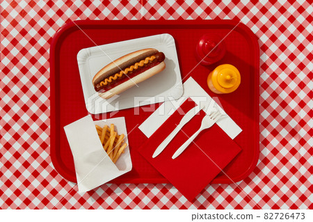 KIEV, UKRAINE - SEPTEMBER 14, 2021.Traditional hot dog, french fries, drink and sauces. Restaurant menu 82726473