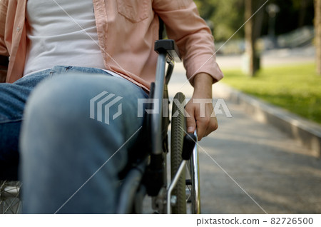 Young male person in wheelchair, paralyzed people 82726500