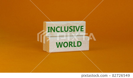 Inclusive world symbol. Wooden blocks with words Inclusive world on beautiful orange background. Business, inclusive world concept. Copy space. Inclusive world symbol. Wooden blocks with words Inclusive world on beautiful orange background. Business, inclusive world concept. Copy space. 82726549