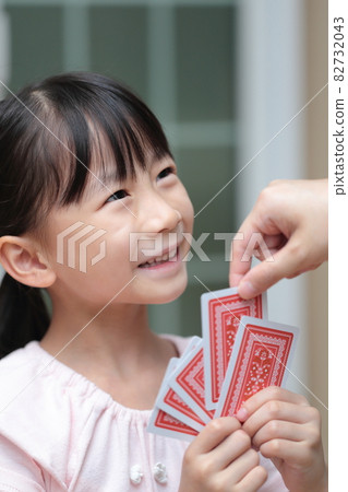 Girl playing cards to maid Girl playing cards to maid 82732043