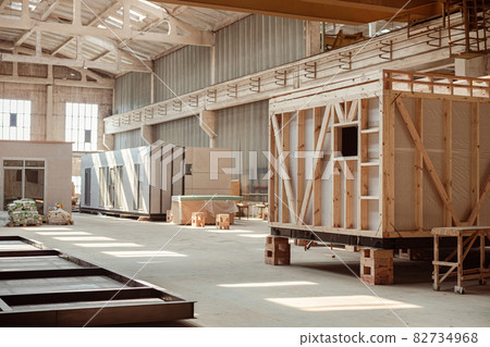 Building under construction with prefabricated containers and cabins 82734968