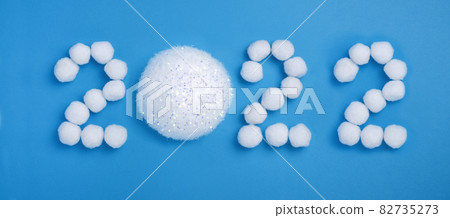 Number 2022 New Year made from snow balls on a blue background Banner 82735273