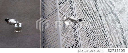 Security cameras on modern building. Professional surveillance camera. CCTV on the wall with LED IR lights. Security system, technology concept. Video equipment for safety system area control outdoor. 82735505