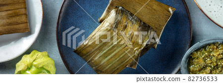 Tamales overhead flat lay panorama. Traditional dish of Mexican cuisine 82736533