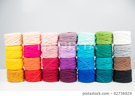 Rows of multicolored cotton yarn. The assortment of the store for needlework. Rows of multicolored cotton yarn. The assortment of the store for needlework. 82736929