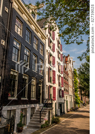 Amsterdam, the Netherlands. A restored warehouse along the Nieuwe Keizersgracht, Amsterdam, Holland. Amsterdam, the Netherlands. A restored warehouse along the Nieuwe Keizersgracht, Amsterdam, Holland. 82739028
