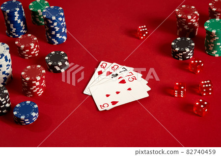 Poker cards and gambling chips on red background 82740459