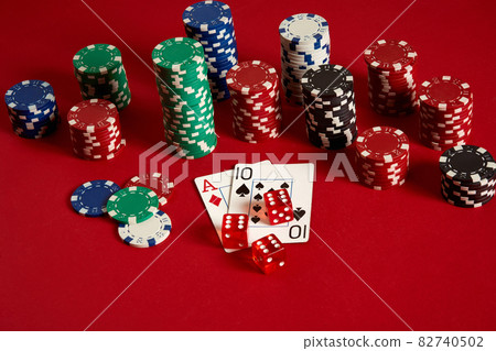 Poker cards and gambling chips on red background 82740502