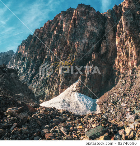 Small glacier in the big mountains. Rocky mountain valley at the high wall of the mountains. Small glacier in the big mountains. Rocky mountain valley at the high wall of the mountains. 82740580