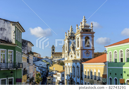 Old colorful houses facades and historic church towers in baroque and colonial style in Pelourinho, Salvador Old colorful houses facades and historic church towers in baroque and colonial style in Pelourinho, Salvador 82743291