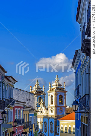 Old colorful houses facades and historic church towers in baroque and colonial style in Pelourinho district Old colorful houses facades and historic church towers in baroque and colonial style in Pelourinho district 82743292