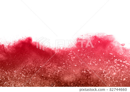 Freeze motion of red powder exploding, isolated on white background. Abstract design of red dust cloud. 82744660