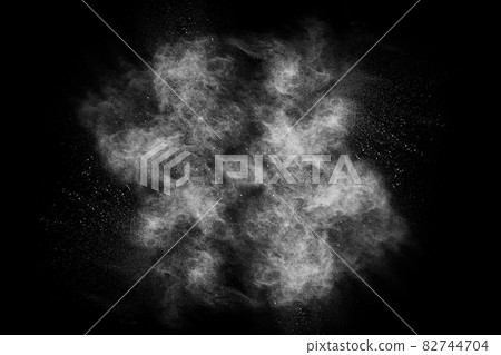 White powder explosion on black background. White powder explosion on black background. 82744704
