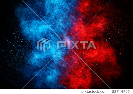 Blue and Red color powder explosion on black background. Colored cloud. Colorful dust explode. Paint Holi. Blue and Red color powder explosion on black background. Colored cloud. Colorful dust explode. Paint Holi. 82744705