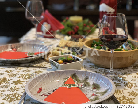 Celebrating Christmas or New Year eve. Party table with wine. Celebrating Christmas or New Year eve. Party table with wine. 82745053