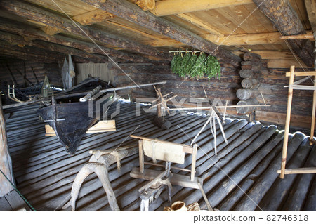 Boat, nets, sleighs and other household items on the second floor of the utility room. House of the Oshevnev peasants from Zaonezh. Kizhi Island. Karelia. Russia Boat, nets, sleighs and other household items on the second floor of the utility room. House of the Oshevnev peasants from Zaonezh. Kizhi Island. Karelia. Russia 82746318