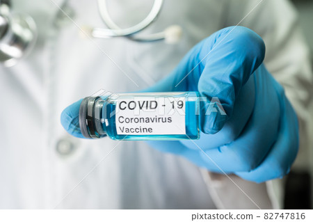 Coronavirus Covid-19 vaccine development medical with syringe for doctor use to treat pneumonia illness patients. 82747816