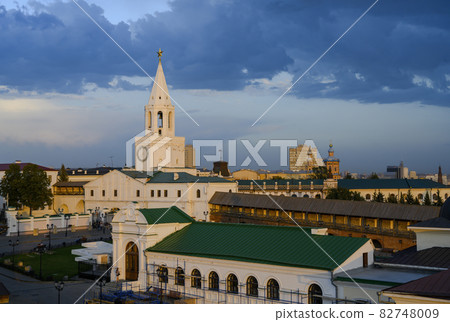 Sunset view of white medieval Spassky bell tower with clock and golden star in Kazan Kremlin, Russia Sunset view of white medieval Spassky bell tower with clock and golden star in Kazan Kremlin, Russia 82748009