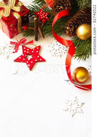 Christmas, new year concept background. Xmas composition. Branches of spruce, present and red decorations. Copy space. Christmas, new year concept background. Xmas composition. Branches of spruce, present and red decorations. Copy space. 82748522
