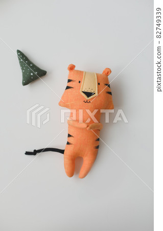 Handmade funny small tiger toy, symbol of new 2022 on white background 82749339