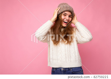 Beautiful positive happy young brunette woman isolated over colourful background wall wearing casual Beautiful positive happy young brunette woman isolated over colourful background wall wearing casual 82750221