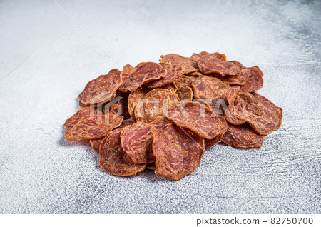Dried Beef and pork meat Jerky. White background. Top view Dried Beef and pork meat Jerky. White background. Top view 82750700
