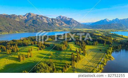 Aerial view over Lake Forggensee at the city of Fuessen in Germany  82752255