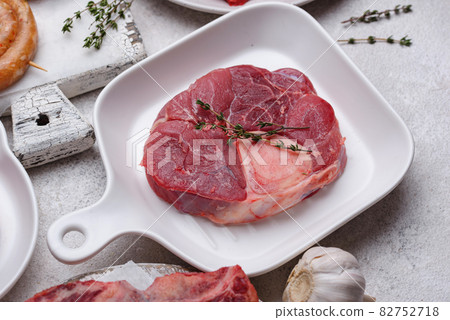 Raw uncooked ossobucco steak with spices Raw uncooked ossobucco steak with spices 82752718