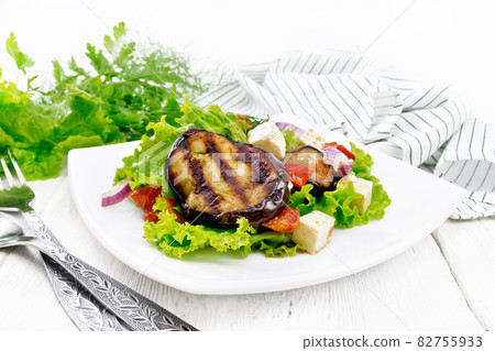 Salad of eggplant with cheese and tomatoes on board 82755933