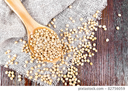 Soybeans in spoon on board top Soybeans in spoon on board top 82756059