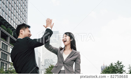 Men and women with high five (business image) Men and women with high five (business image) 82758688