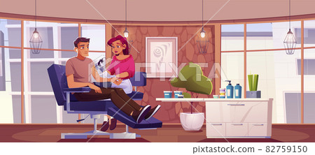 Man get tattoo in salon, tattooist woman drawing Man get tattoo in salon, tattooist woman drawing 82759150
