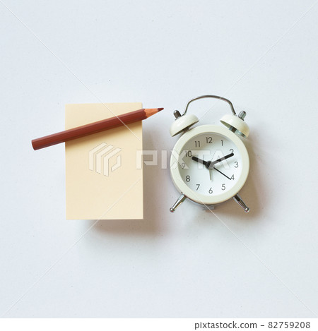 Blank memo paper, pencil, clock on white background. top view, copy space Blank memo paper, pencil, clock on white background. top view, copy space 82759208