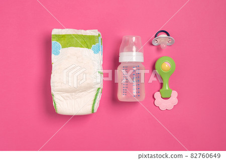 Baby care accessories and diapers on pink background. Top view Baby care accessories and diapers on pink background. Top view 82760649