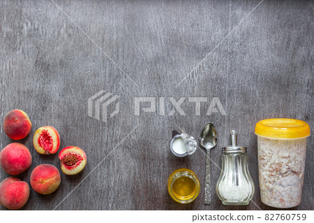 Ingredients for oatmeal on dark wooden table. Concept of healthy food. Top view, copy space. 82760759